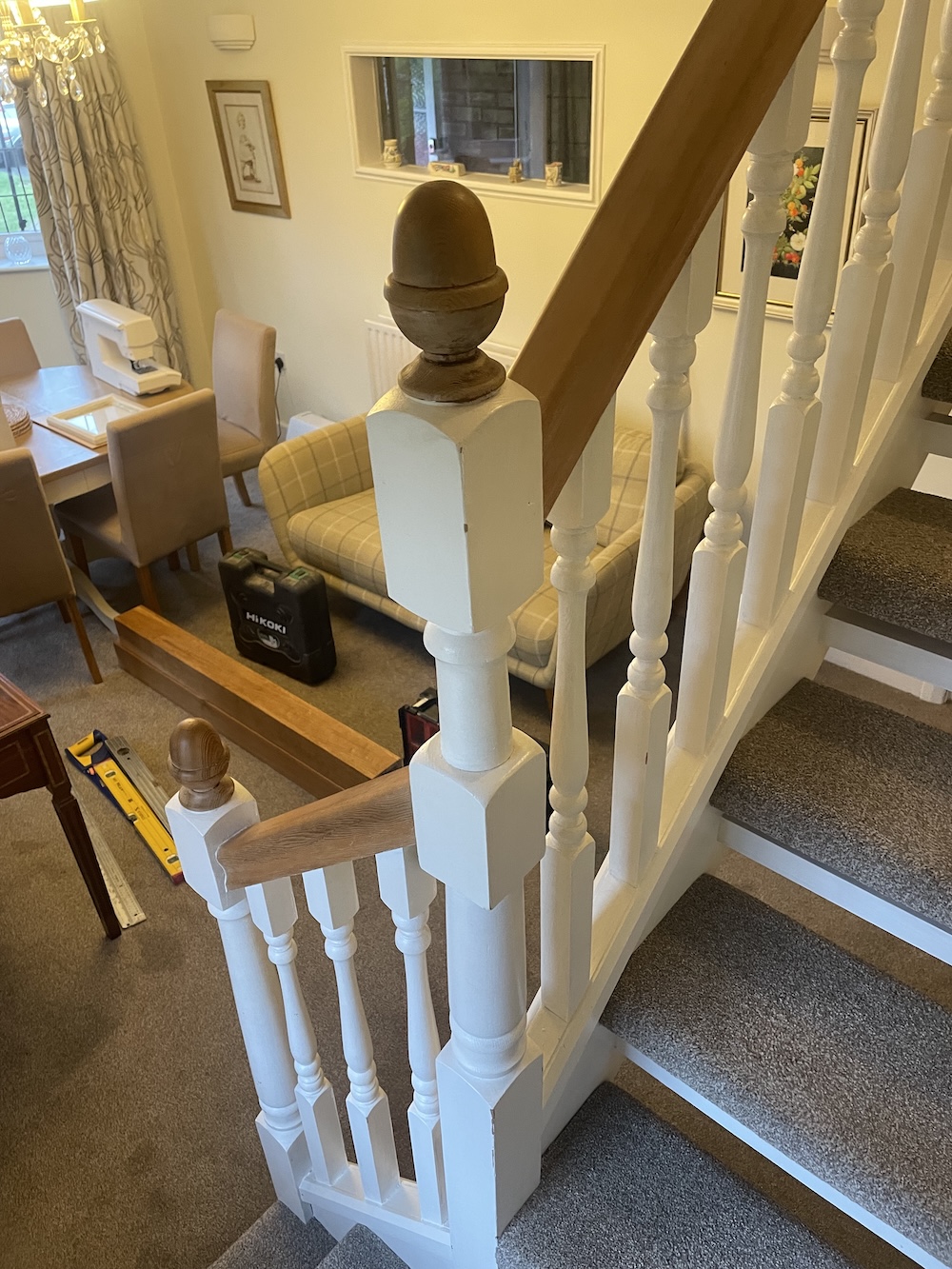 Open tread staircase renovation in Burbage featuring bespoke oak newel posts, modern twist metal spindles, and custom under-stair doors. A stylish upgrade completed in just two days by Robert McVey Staircases.
